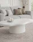 Table basse ovale en béton brossé blanc plateau asymétrique ZELINE
